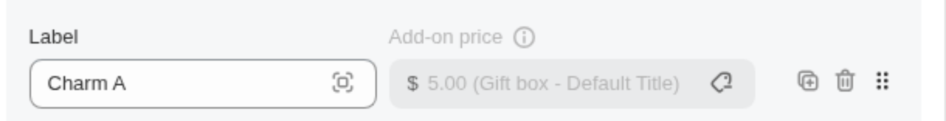 An option value row with Charm A linked to Gift box, showing $5.00 and the product name in the add-on price field